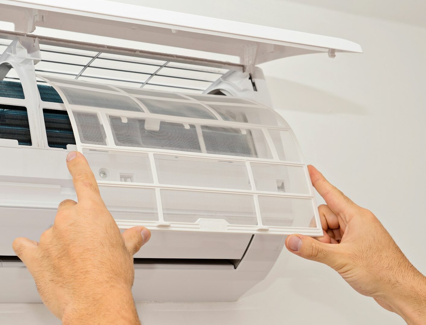 Changing the filter of the air conditioner. Changing filter in air conditioning.